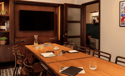 Wood-Panelled Library Room with Integrated Presentation Screen