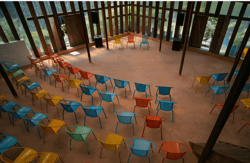 Rustic Pavillion With a Mezzanine Level for Creative Workshops