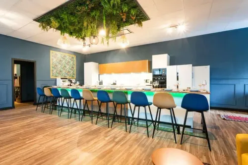 Chic Culinary Space With Suspended Greenery for Team-Building Activities