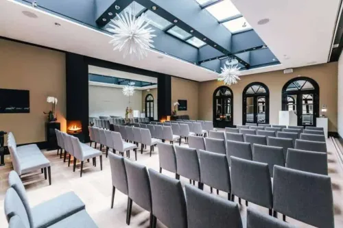 Skylit Hall With Starburst Chandeliers for Business Events