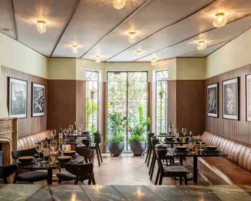 Chic Mid-Century Cafe With Stylish Decor for Elegant After-Work Events