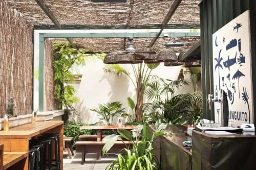 Rustic Rooftop Escape With Tropical Flair for Relaxed Urban Mixers