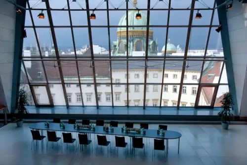 Angular Glass Wall and Dome Views in a Futuristic Hall for Corporate Events