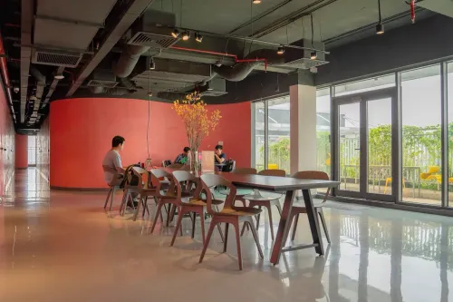 Bright Red Workspace Lounge With Terrace Access for Team Off-Sites