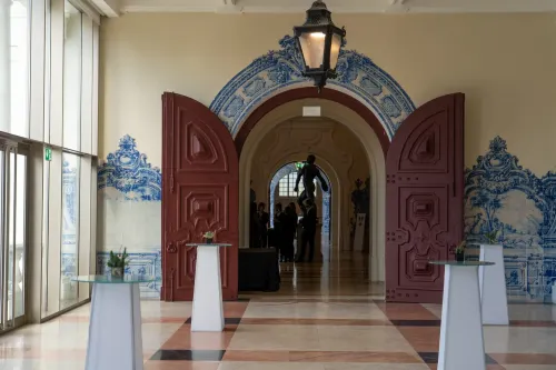 Classic Foyer With Wooden Carved Doors, and Stunning Tile Murals
