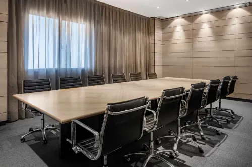 Sophisticated Boardroom With Elegant Sheer Curtains for Elite Business Sessions