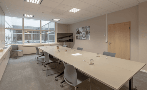 Streamlined Boardroom With Courtyard Views for Meetings