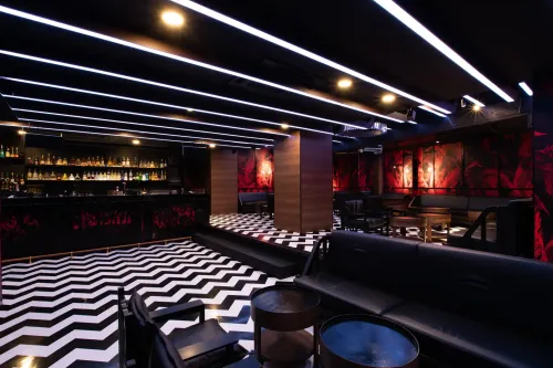 Immersive Nightclub With Timber Arches and Zigzag Floors for Unforgettable After-Parties