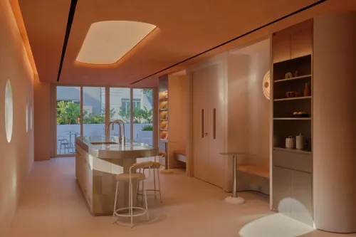 Warm-Hued Indoor-Outdoor Studio With Sculptural Design for Networking and Mixers