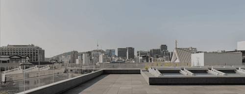 Industrial Rooftop Oasis With Lush Greenery for Stylish Events and Gatherings