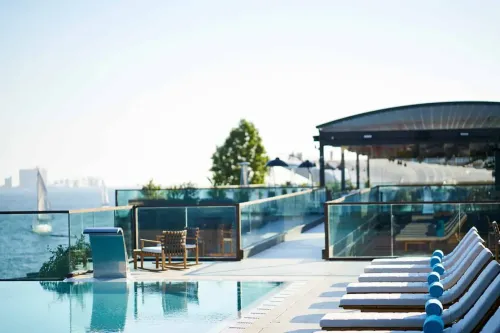 Magical Poolside Lounge With Astonishing River Views for Chic Networking Events