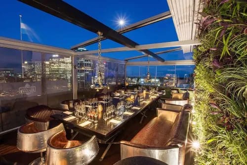 Vibrant Rooftop Skybar with Warm Lighting and Scenic Views for Iconic Events
