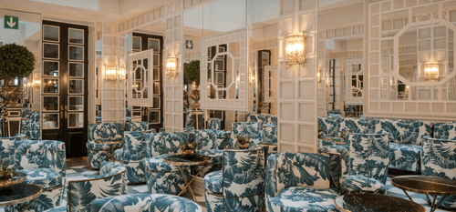 Victorian-Style Salon With Mirrored Walls for Private Gatherings