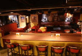 Hidden Retro Lounge With Warm Lighting and Vintage Decor for Intimate Gatherings