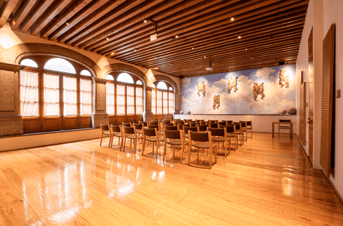 Colonial Ballroom With Murals and Vaulted Stone Arches