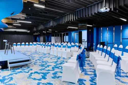 Blue-Accented Geometric Conference Room for Workshops and Seminars