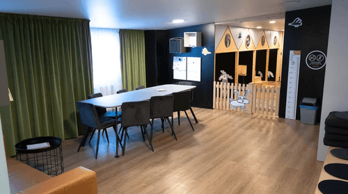 Playful Nordic-Inspired Lounge With Creative Kids’ Nook for Informal Meetings