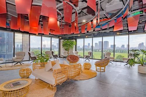 Glass-Walled Lounge With City Views for Creative Workshops