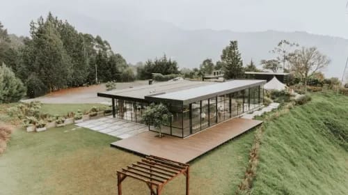 Glass-Walled Paradise for Stylish Events Amidst Lush Greenery
