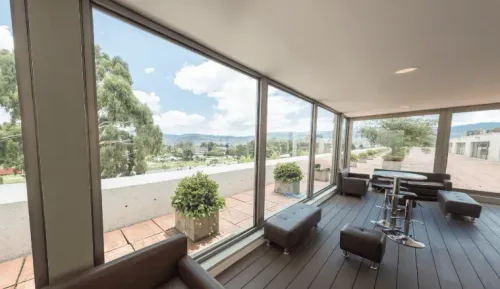 Glass-Enclosed Venue With Scenic Views for Networking & Workshops