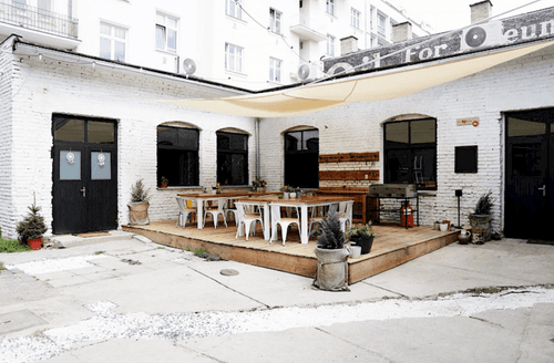 White Brick Venue With Elevated Outdoor Patio for Casual Events