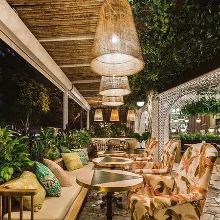 Rustic Tropical Oasis With Lush Greenery for Unique Dining Events