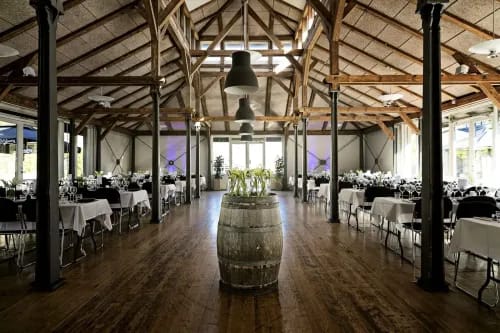 Contemporary Rustic Restaurant With Exposed Trusses and Courtyard Terrace for Networking Events
