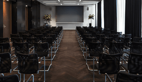 Contemporary Conference Hall with Full-Width Projection Screen