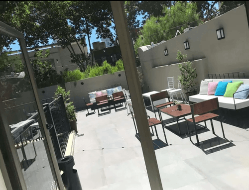 Elegant Rooftop Haven with Bold Hues and Chic Ambience for Memorable Events