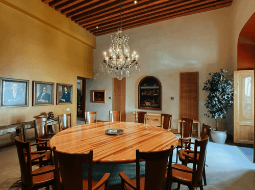 Colonial Dining Room With Timber Beams and Crystal Chandelier