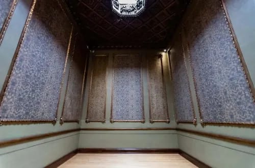 Ornate Gold-Toned Room With Rich Décor for Elegant Soirees