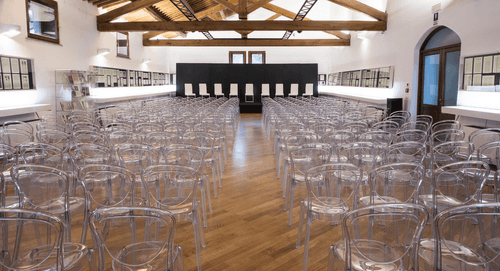 High-Ceilinged Hall With Exposed Wooden Beams and Historic Aesthetic for Conferences and Creative Exhibitions