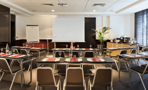 Minimalistic Boardroom With Greenery, Sleek Furnishings and Flexible Layout