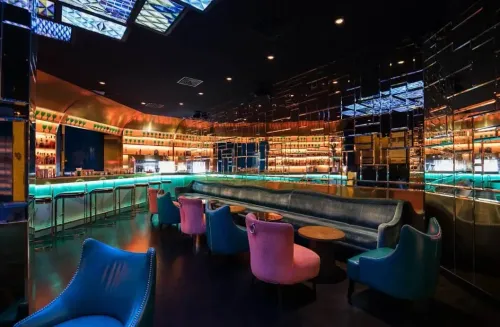Vibrant Art Deco Bar With Neon Lighting for Happy Hour Mixers