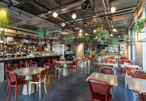 Industrial-Chic Space With Vibrant Greenery for Creative Workshops