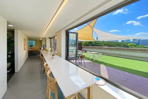 Sun-Shaded Rooftop Terrace With Turf and Skyline Views for Team Gatherings