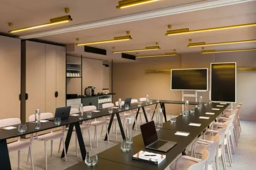 Sleek and Trendy Space With Soft Ambient Lighting for Dynamic Panel Meetings