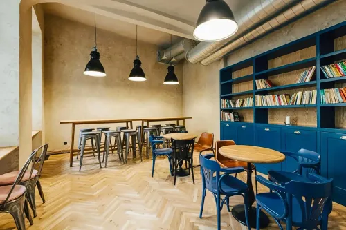Hidden Library Room With Blue Shelving for Small Private Gatherings