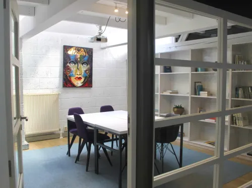 Intimate Creative Meeting Room with Artistic Flair for Strategy Sessions