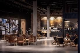 Industrial Brick-Walled Lounge With Panoramic Mural for Networking Events