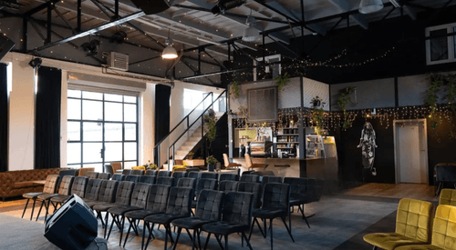 Industrial Loft With Warm Lighting and Barista Station for Creative Brand Events