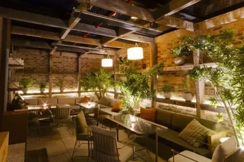 Industrial Garden Venue With Chic Greenery for Exclusive Gatherings