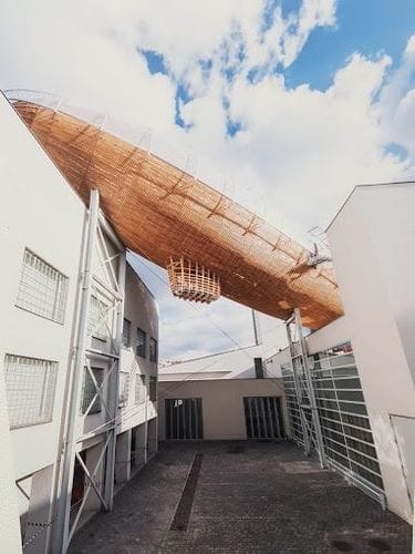 Avant-Garde Wooden Airship Venue for Educational Workshops