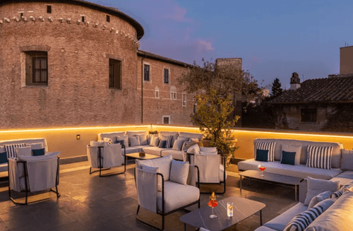 Tranquil Roman Rooftop Terrace With Historic Backdrop for Sunset Networking Evenings