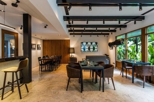 Modern Industrial Dining Room With Garden Views for Team Luncheons