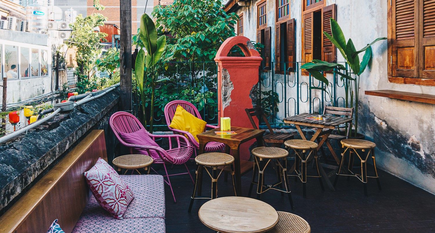 Pakio Rooftop Vibrant Rooftop Patio With Colourful Wicker Furnishings for Casual and ...