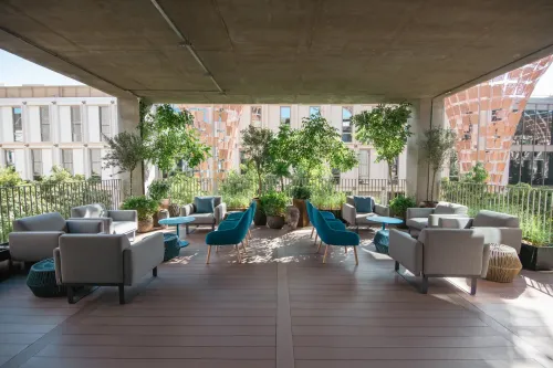 Relaxed Garden Terrace Sourounded by Greenery for Intimate Dinners. The Nexus. Garden Terrace