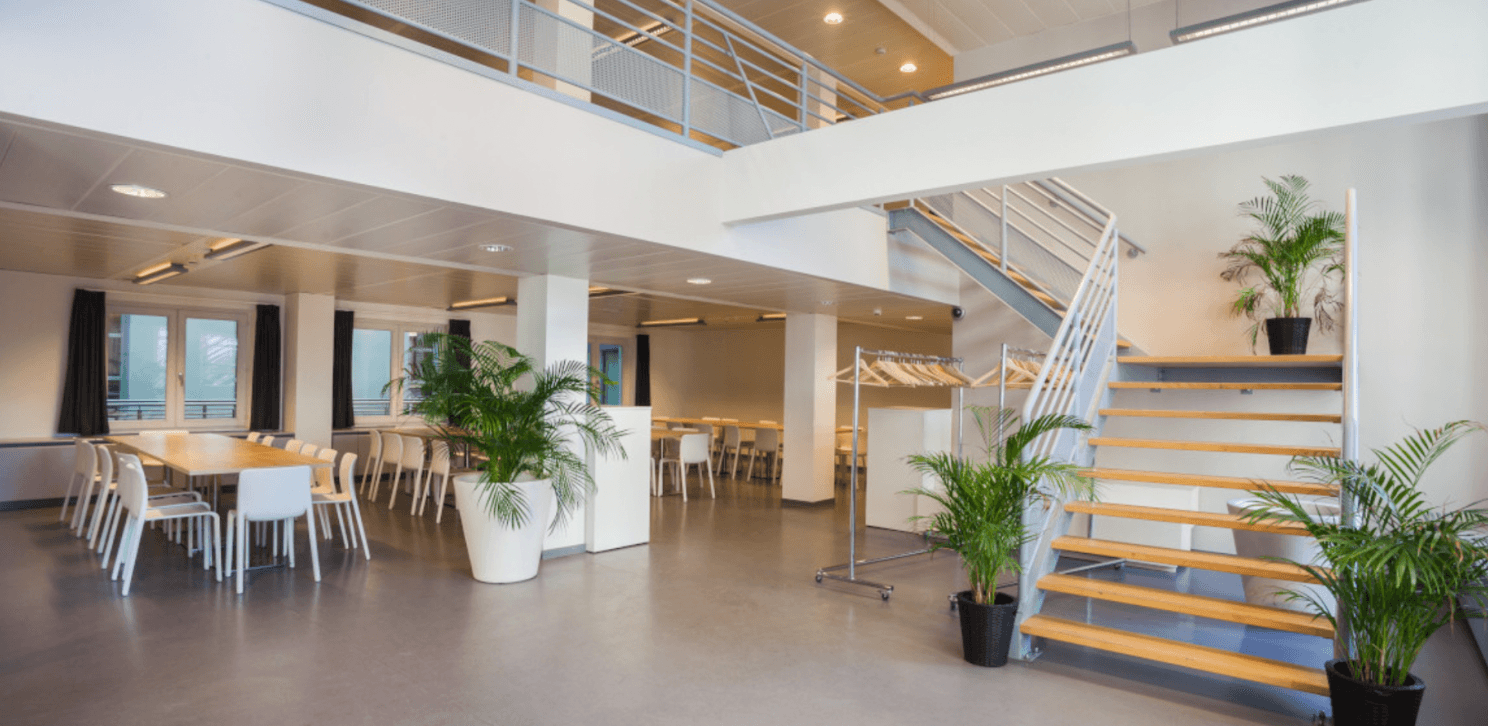 Modernist Atrium With Open Staircase and Place Royale Views for ...