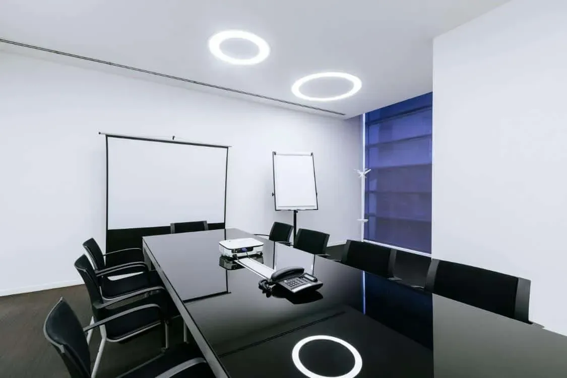 Sleek Minimalist Boardroom With Circular LED Lighting for Strategic ...