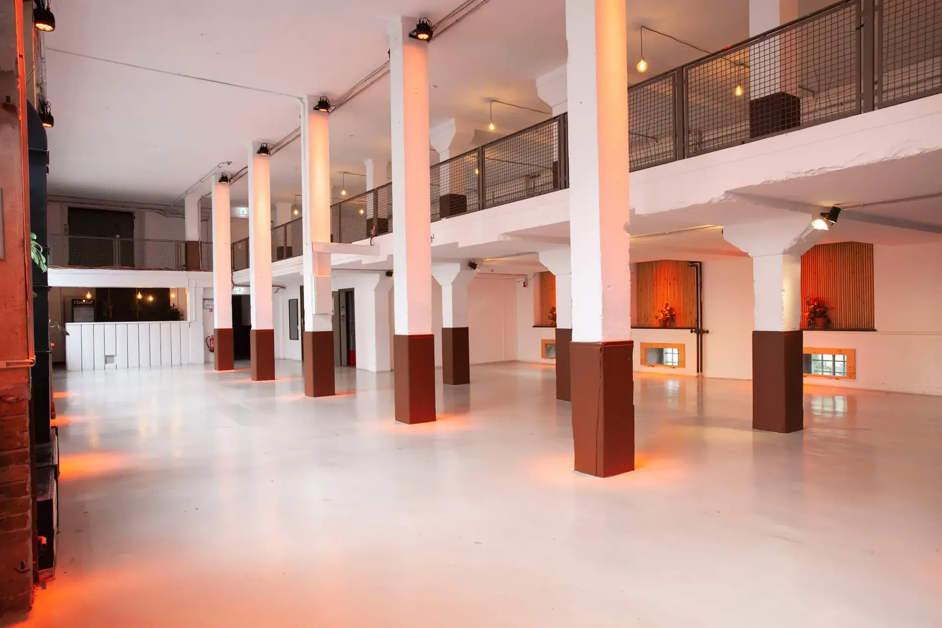 Spacious Two-Level Industrial Hall With Tall Windows for After-Session ...
